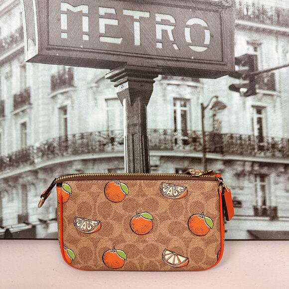 Coach Handbags - Coach CAL27 Nolita 19 In Signature Canvas With Orange Print